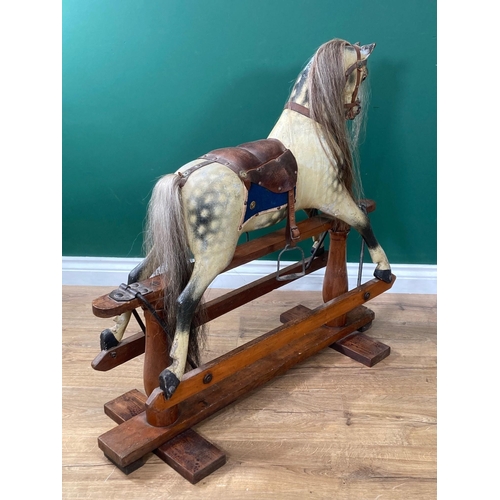 592 - An antique dappled palomino Rocking Horse of small proportions in the manner of Lines on pine slidin... 