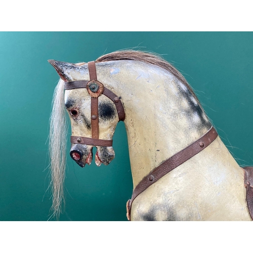 592 - An antique dappled palomino Rocking Horse of small proportions in the manner of Lines on pine slidin... 