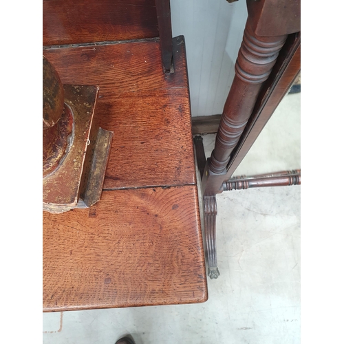 594 - An antique oak Dresser with boarded rack, the base fitted three drawers above shaped frieze on squar... 