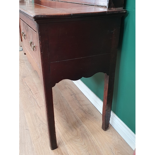 594 - An antique oak Dresser with boarded rack, the base fitted three drawers above shaped frieze on squar... 