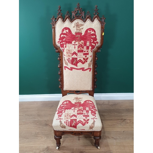 596 - A Victorian Gothic Revival walnut framed Prayer Chair with cream cushioned upholstery decorated with... 