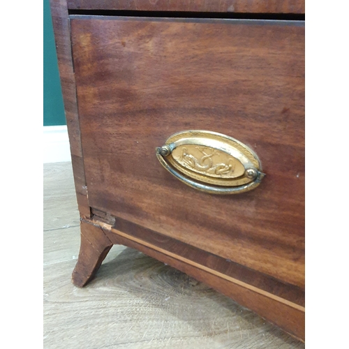 601 - A late Georgian mahogany Dressing Chest with brushing slide above three long drawers on splay feet, ... 