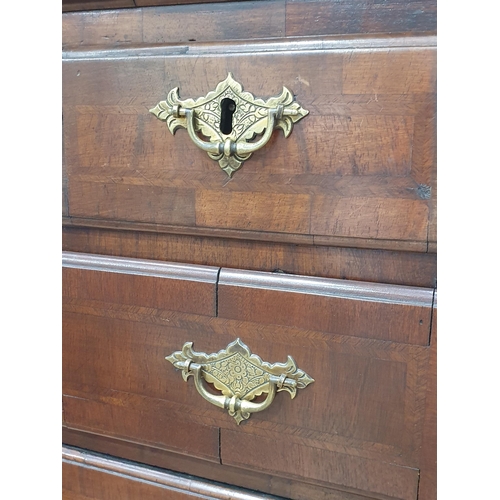 604 - An 18th Century walnut Chest on Stand, fitted three small drawers above four long drawers, all with ... 