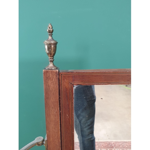 608 - A 19th century mahogany Cheval Mirror of small proportions having urn finials and adjustable candle ... 