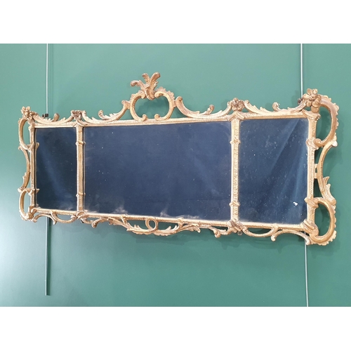 609 - An 18th Century decorative gilt gesso rococo style Overmantle Mirror having three panels enclosed by... 