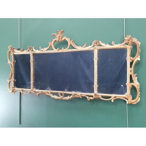 609 - An 18th Century decorative gilt gesso rococo style Overmantle Mirror having three panels enclosed by... 