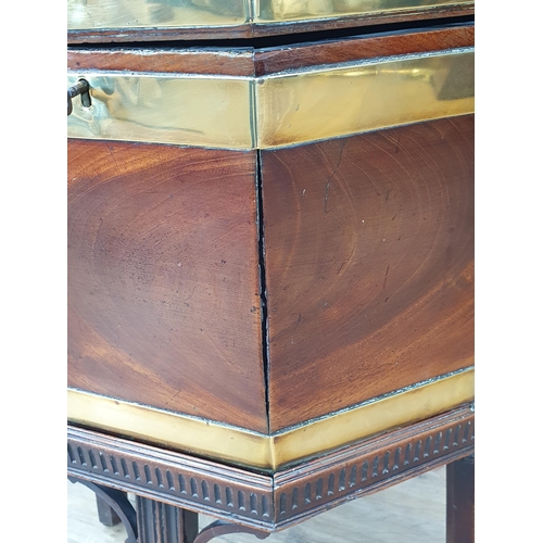 611 - A Georgian mahogany brass bound Wine Cooler of octagonal form, the hinged cover enclosing the divide... 