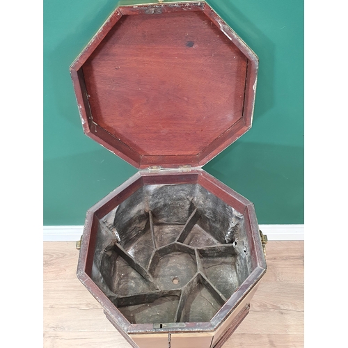 611 - A Georgian mahogany brass bound Wine Cooler of octagonal form, the hinged cover enclosing the divide... 