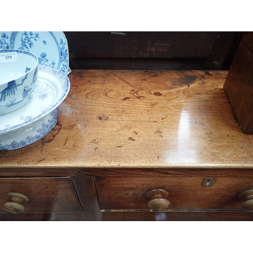 613 - An 18th Century Shropshire elm Dresser Base fitted three drawers on squared supports with shaped fri... 