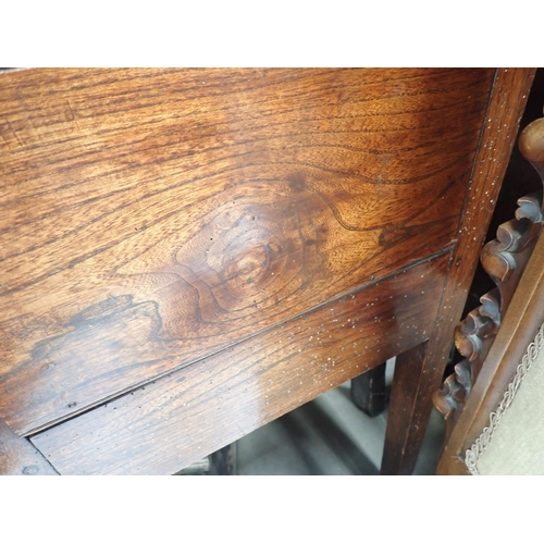 613 - An 18th Century Shropshire elm Dresser Base fitted three drawers on squared supports with shaped fri... 