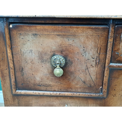 615 - A Georgian style walnut Lowboy with quarter veneered crossbanded top above an arrangement of three d... 