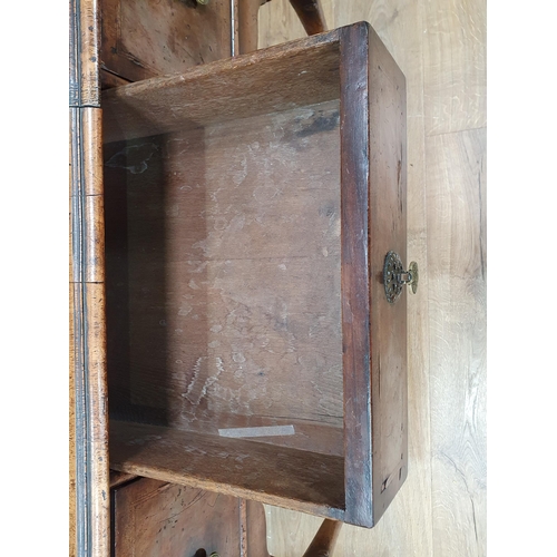 615 - A Georgian style walnut Lowboy with quarter veneered crossbanded top above an arrangement of three d... 