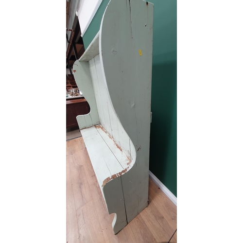 622 - A 19th Century pine high backed Settle with later green paint on shaped end supports 5ft 5in H x 5ft... 