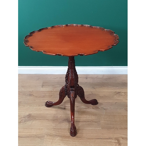 623 - A Georgian style mahogany pie crust Pillar Table on leafage carved column and three claw and ball fe... 