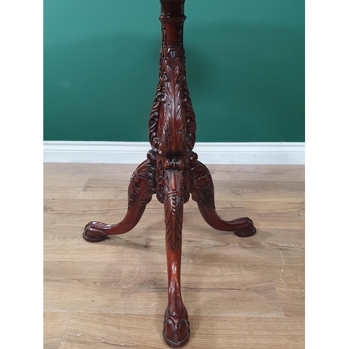 623 - A Georgian style mahogany pie crust Pillar Table on leafage carved column and three claw and ball fe... 