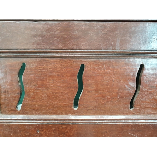 626 - A 17th Century oak Food Cupboard having a pair of pierced and panelled doors on later plinth base, 5... 