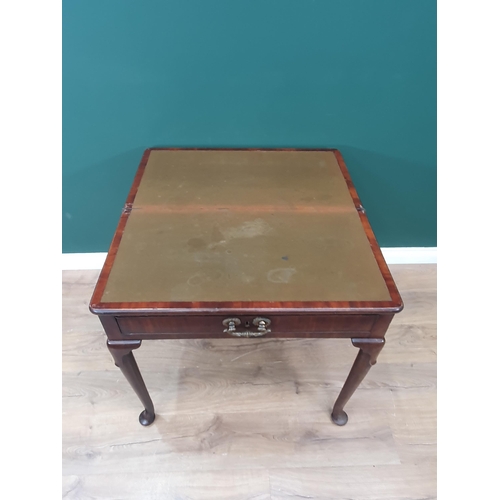 628 - A Georgian mahogany Card Table with fold-over top supported on two swing supports, the turned suppor... 