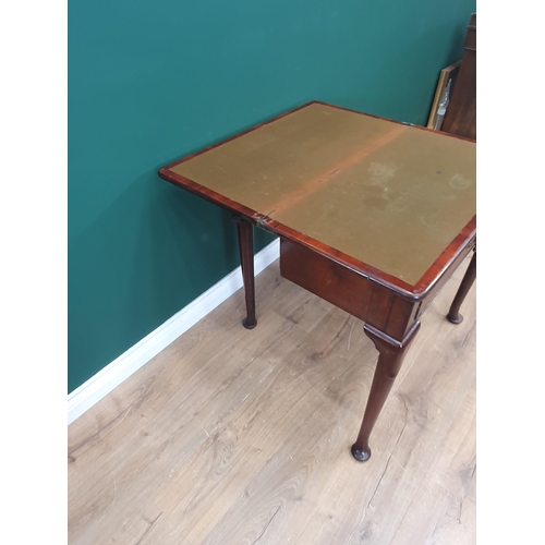 628 - A Georgian mahogany Card Table with fold-over top supported on two swing supports, the turned suppor... 