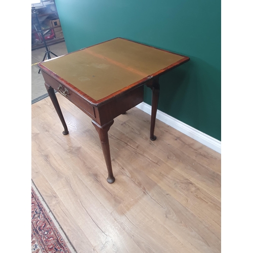 628 - A Georgian mahogany Card Table with fold-over top supported on two swing supports, the turned suppor... 