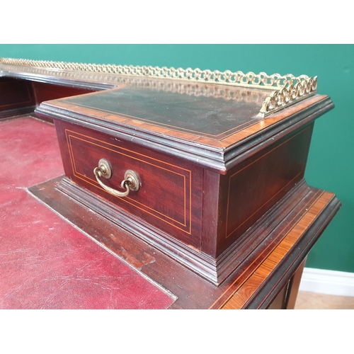 630 - A 19th Century mahogany and crossbanded Desk, the raised back with brass gallery, fitted two drawers... 