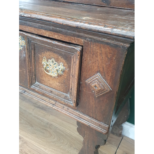 637 - A late 17th Century oak Dresser and Rack the base fitted three moulded drawers divided by lozenge bo... 