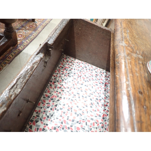 637 - A late 17th Century oak Dresser and Rack the base fitted three moulded drawers divided by lozenge bo... 