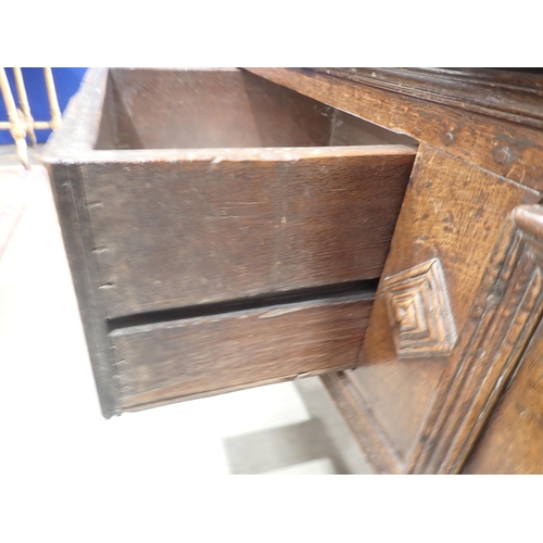 637 - A late 17th Century oak Dresser and Rack the base fitted three moulded drawers divided by lozenge bo... 