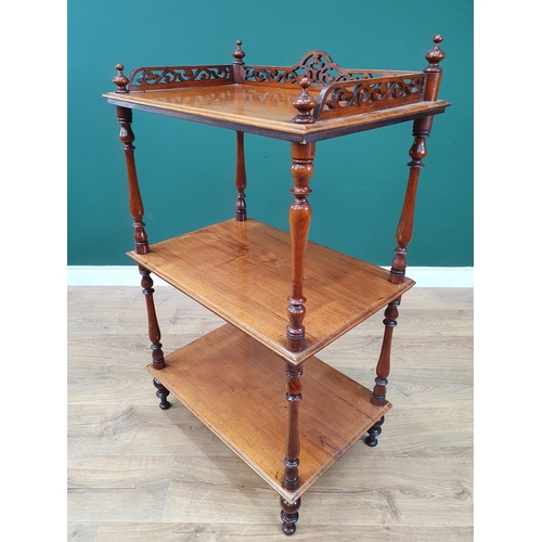 639 - A 19th Century mahogany three tier Whatnot with pierced raised gallery on baluster turned supports, ... 