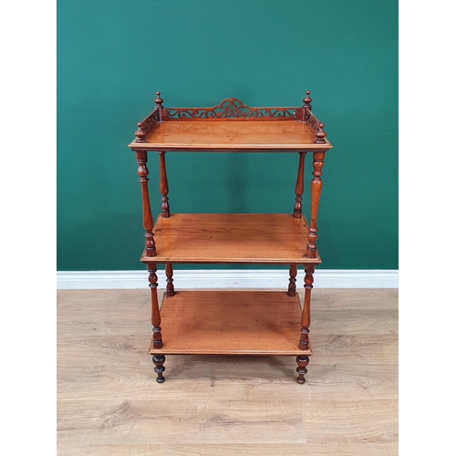 639 - A 19th Century mahogany three tier Whatnot with pierced raised gallery on baluster turned supports, ... 