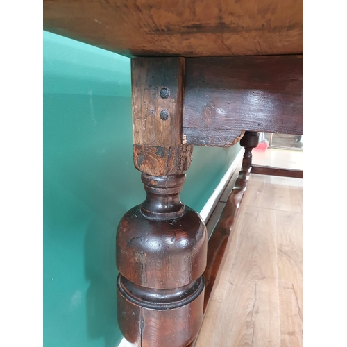 643 - An antique oak Refectory Table with 17th Century elements, having a three plank cleated top, raised ... 