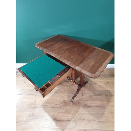 645 - A Regency mahogany Writing Table with drop leaves, fitted two drawers, the top drawer fitted with wr... 