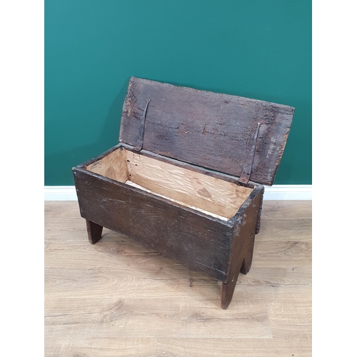 659 - A 17th Century oak six plank Coffer with hinged top and shaped end supports, 2ft 10in W