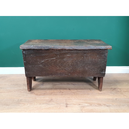 659 - A 17th Century oak six plank Coffer with hinged top and shaped end supports, 2ft 10in W