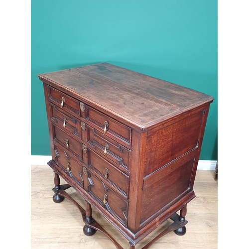 662 - An 18th Century oak Chest on Stand, the two short and three long drawers with moulded drawer fronts,... 