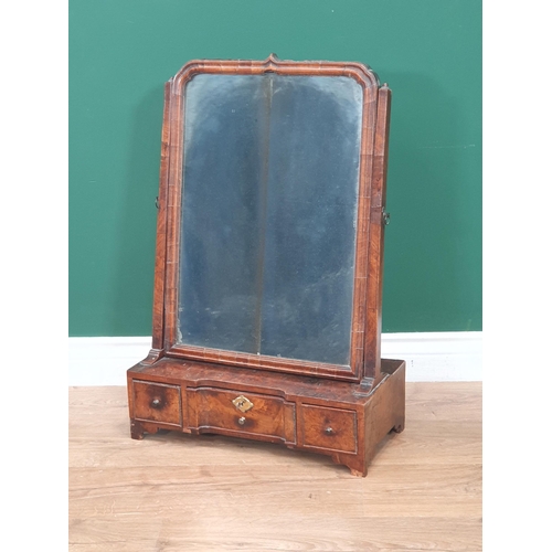 663 - An 18th Century walnut Dressing Mirror with rectangular plate above an inverted breakfront base fitt... 