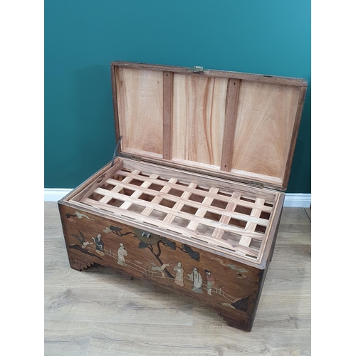 665 - An antique camphor wood Chest with hinged cover and inlaid with Chinese figures in Jade type stones