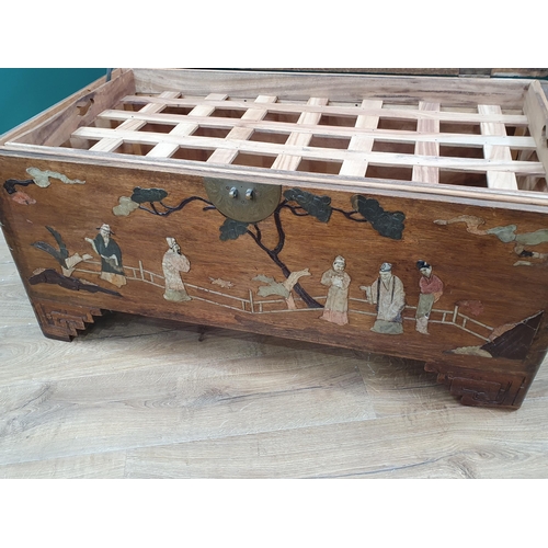 665 - An antique camphor wood Chest with hinged cover and inlaid with Chinese figures in Jade type stones