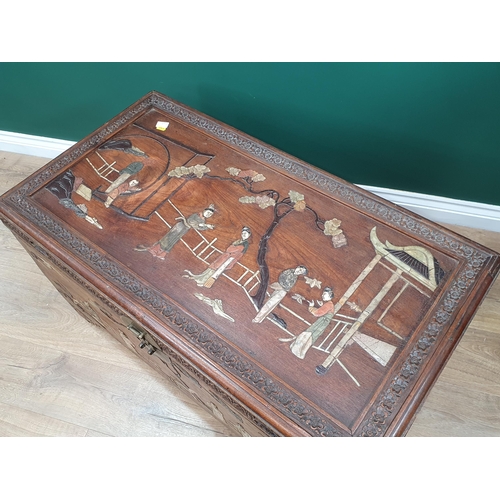 665 - An antique camphor wood Chest with hinged cover and inlaid with Chinese figures in Jade type stones