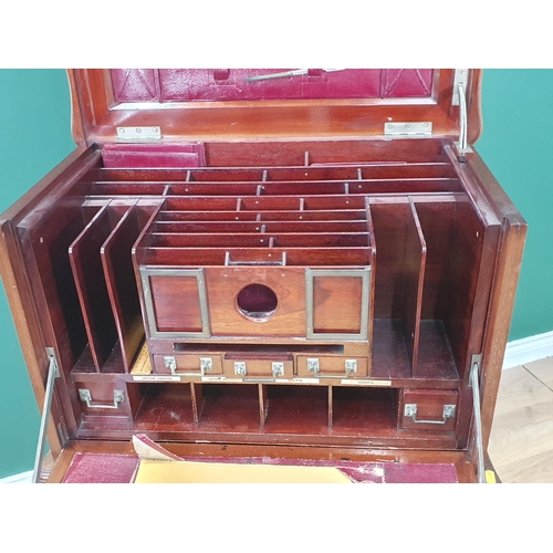 667 - A 1920's mahogany Desk with hinged top and front, opening to reveal a fitted interior of pigeon hole... 