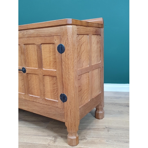 678 - A Mouseman Thompson oak Dresser Base with pair of six panel doors flanking three drawers, 6ft wide, ... 