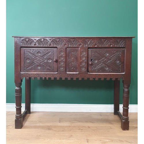 682 - A 17th Century and later oak Cupboard or Hutch fitted pair of carved doors mounted upon turned front... 