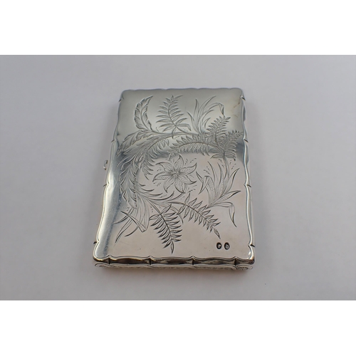 73 - A Victorian silver Card Case with silk interior engraved ladies skating on a lake and ferns to rever... 