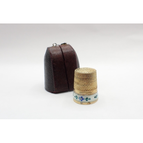 87 - A silver gilt Thimble with enamel band painted forget-me-nots in leather case