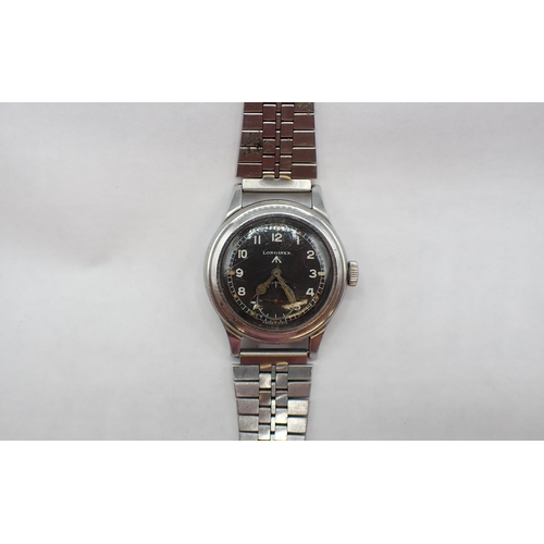 94 - A gentleman's Longines military issue 'Dirty Dozen' Wristwatch the black dial with luminous dot mark... 