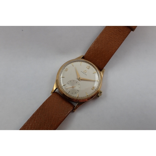 97 - A gentleman's 1956 9ct gold cased Omega manual wind Wristwatch the champagne dial with arabic numera... 