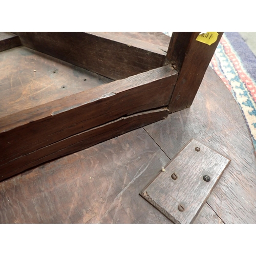 572 - An 18th Century oak Cricket Table with lower galleried tier on three chamfered supports (lower secti... 