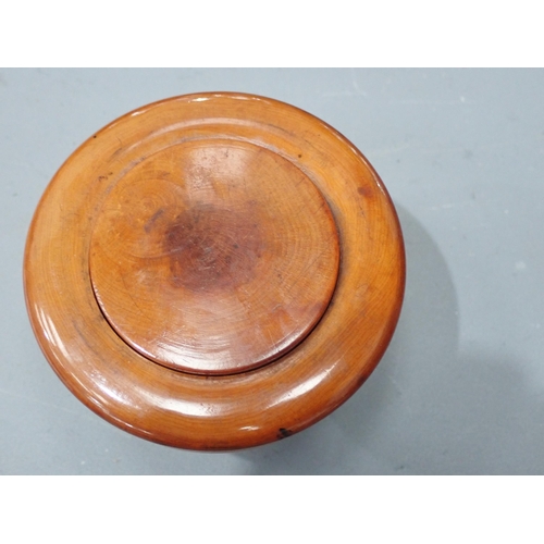 409 - A turned boxwood Box with threaded domed cover, cork lined, marked S. Maw & Sons of London, 3½in dia... 