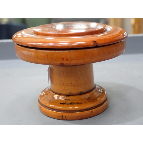 409 - A turned boxwood Box with threaded domed cover, cork lined, marked S. Maw & Sons of London, 3½in dia... 