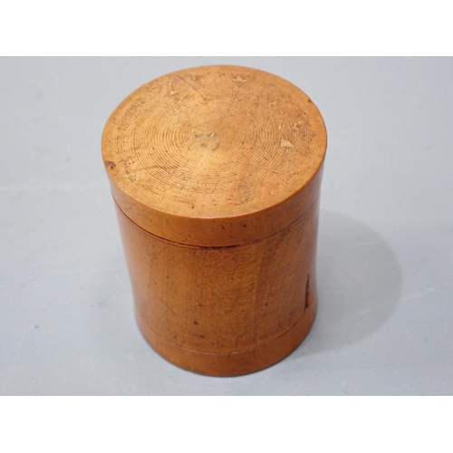 409 - A turned boxwood Box with threaded domed cover, cork lined, marked S. Maw & Sons of London, 3½in dia... 