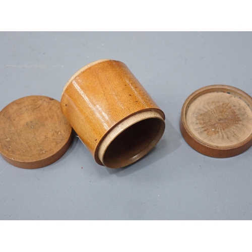 409 - A turned boxwood Box with threaded domed cover, cork lined, marked S. Maw & Sons of London, 3½in dia... 